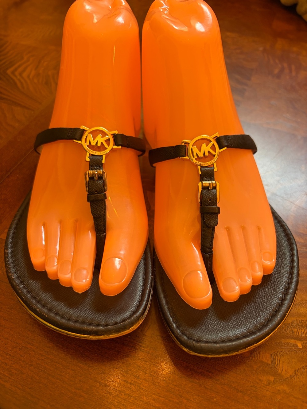 Michael Kors Black Leather T-Strap Sandals with Gold MK Medallions